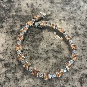 Princess cut, champagne and white colored cubic zirconia tennis bracelet